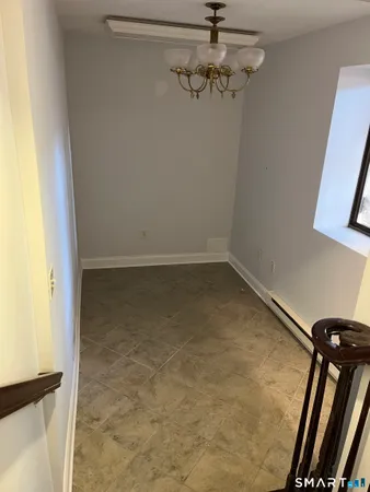 a view of a room with rack on the wall