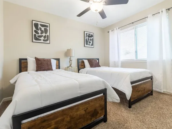 a bedroom with a bed and window