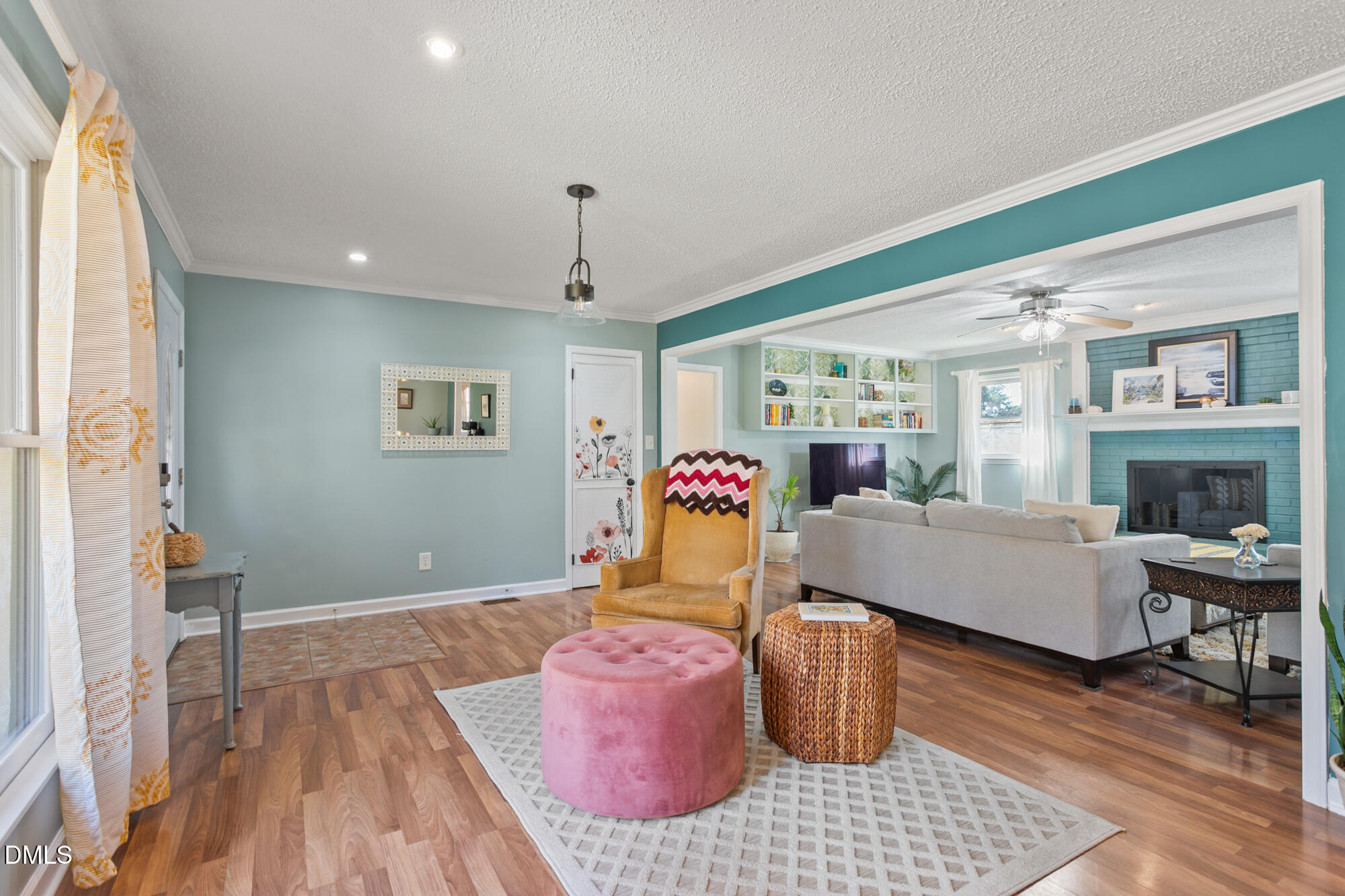 1263 Geneva Albright Road Graham, NC 27253 - Photo 16 of 61 a living room with furniture wooden floor and a chandelier