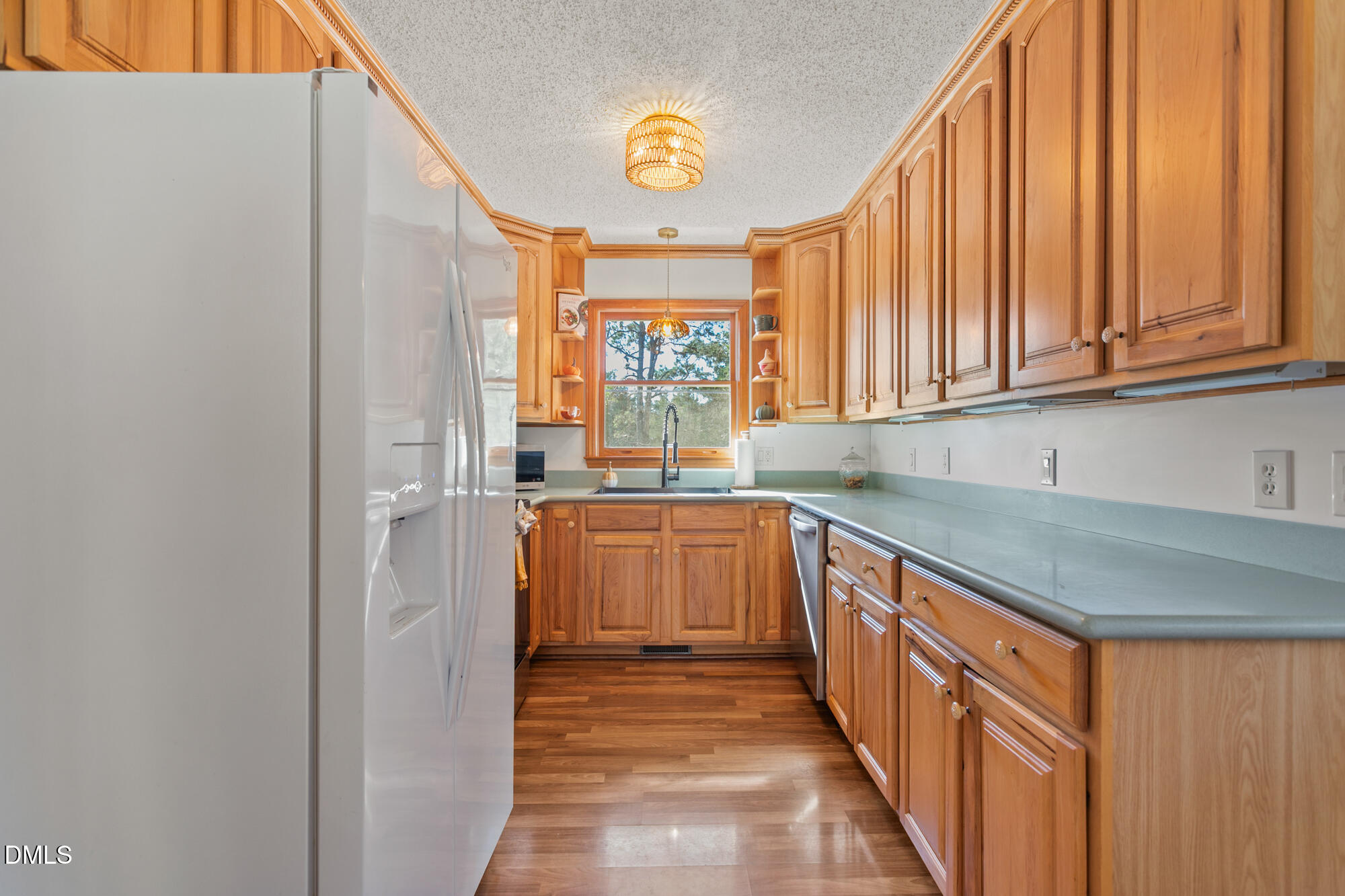 1263 Geneva Albright Road Graham, NC 27253 - Photo 18 of 61 a kitchen with granite countertop a sink and a stove next to a window