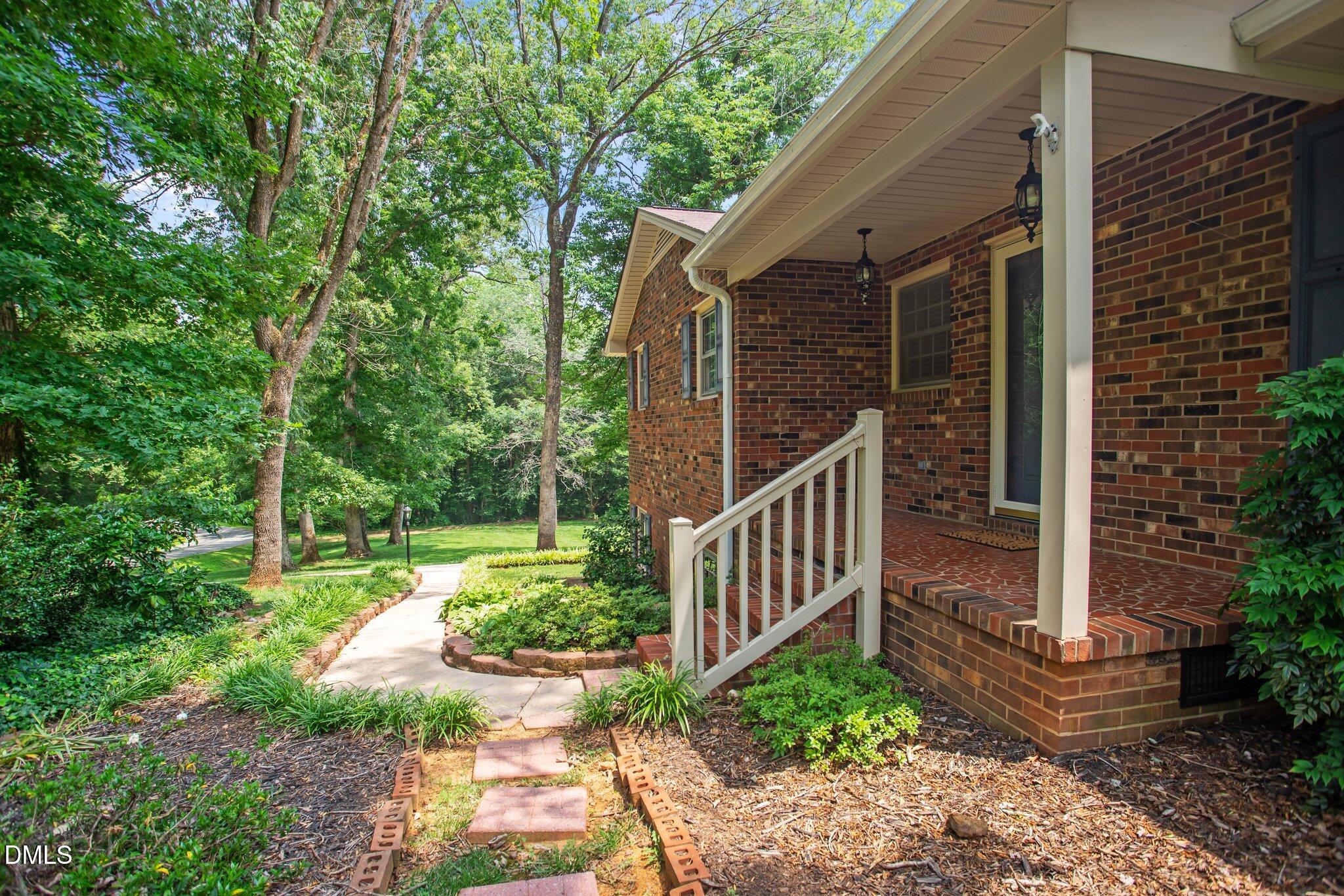 1263 Geneva Albright Road Graham, NC 27253 - Photo 2 of 61 a view of a house with backyard and garden