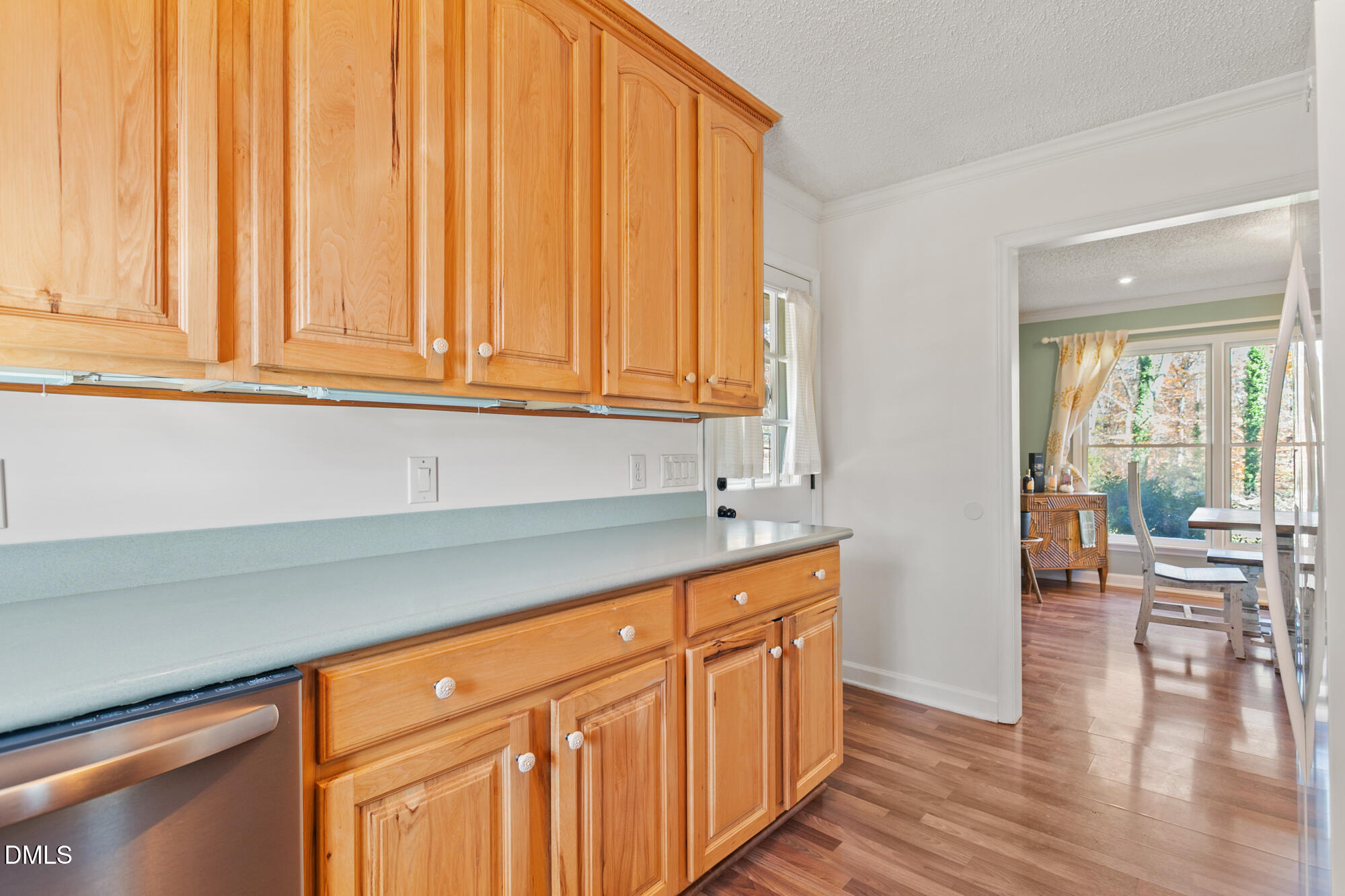1263 Geneva Albright Road Graham, NC 27253 - Photo 21 of 61 a kitchen with wooden cabinets and sink