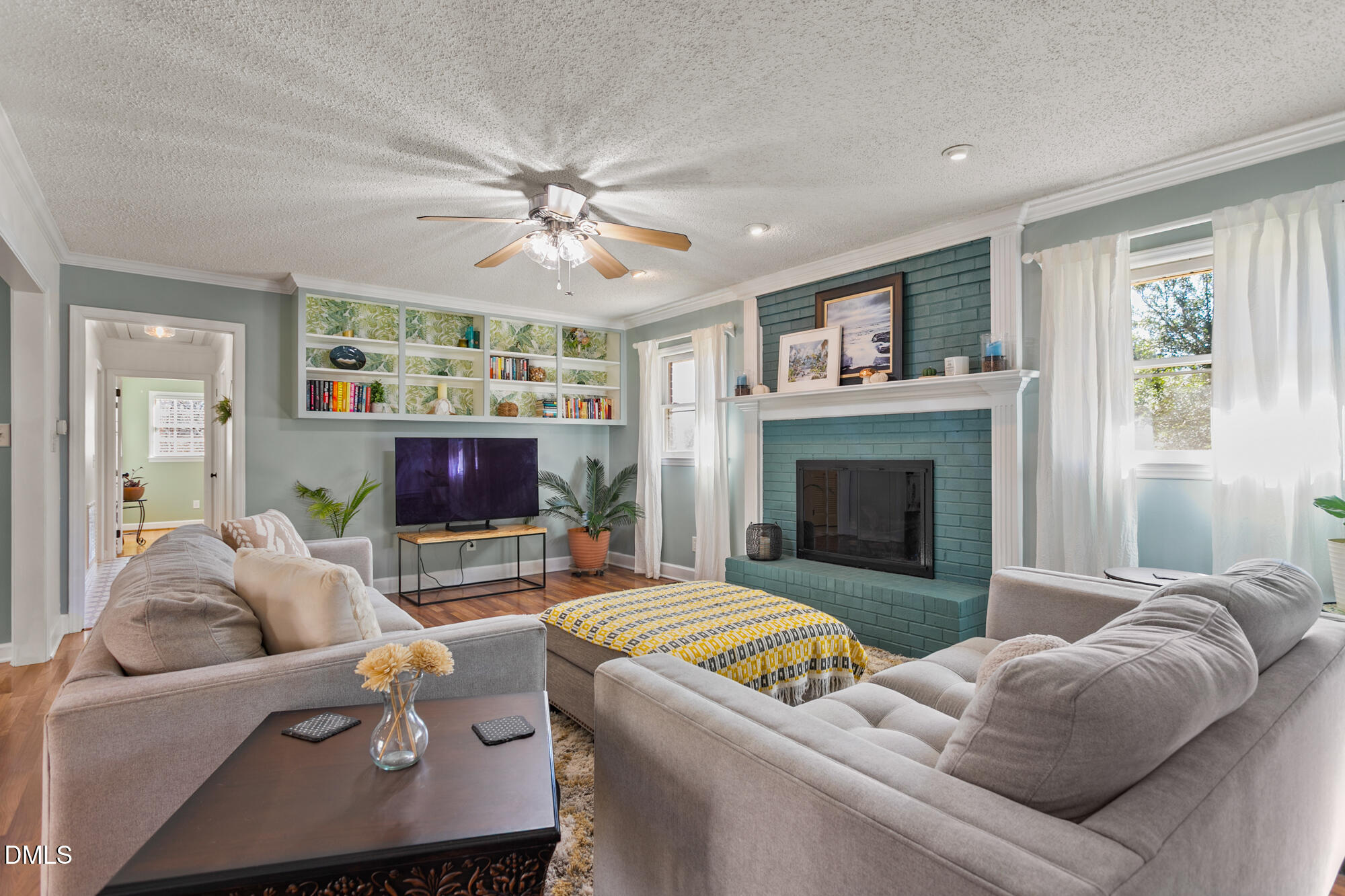 1263 Geneva Albright Road Graham, NC 27253 - Photo 22 of 61 a living room with furniture and a fireplace