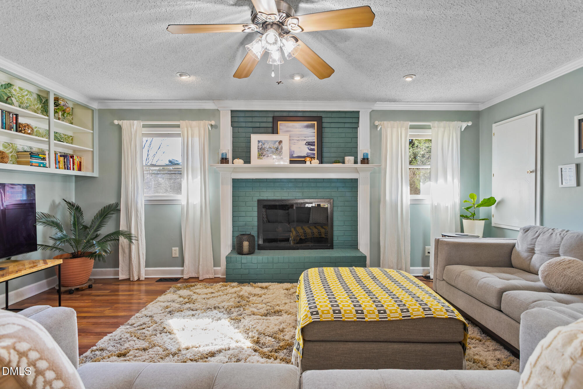 1263 Geneva Albright Road Graham, NC 27253 - Photo 23 of 61 a living room with furniture and a fireplace