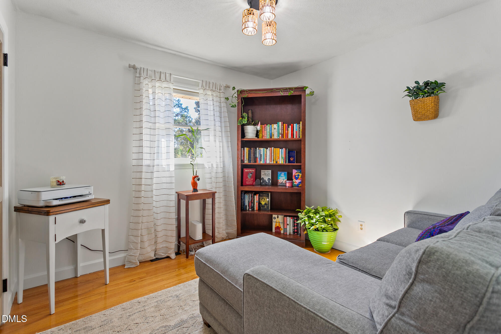 1263 Geneva Albright Road Graham, NC 27253 - Photo 28 of 61 a living room with furniture and a chandelier
