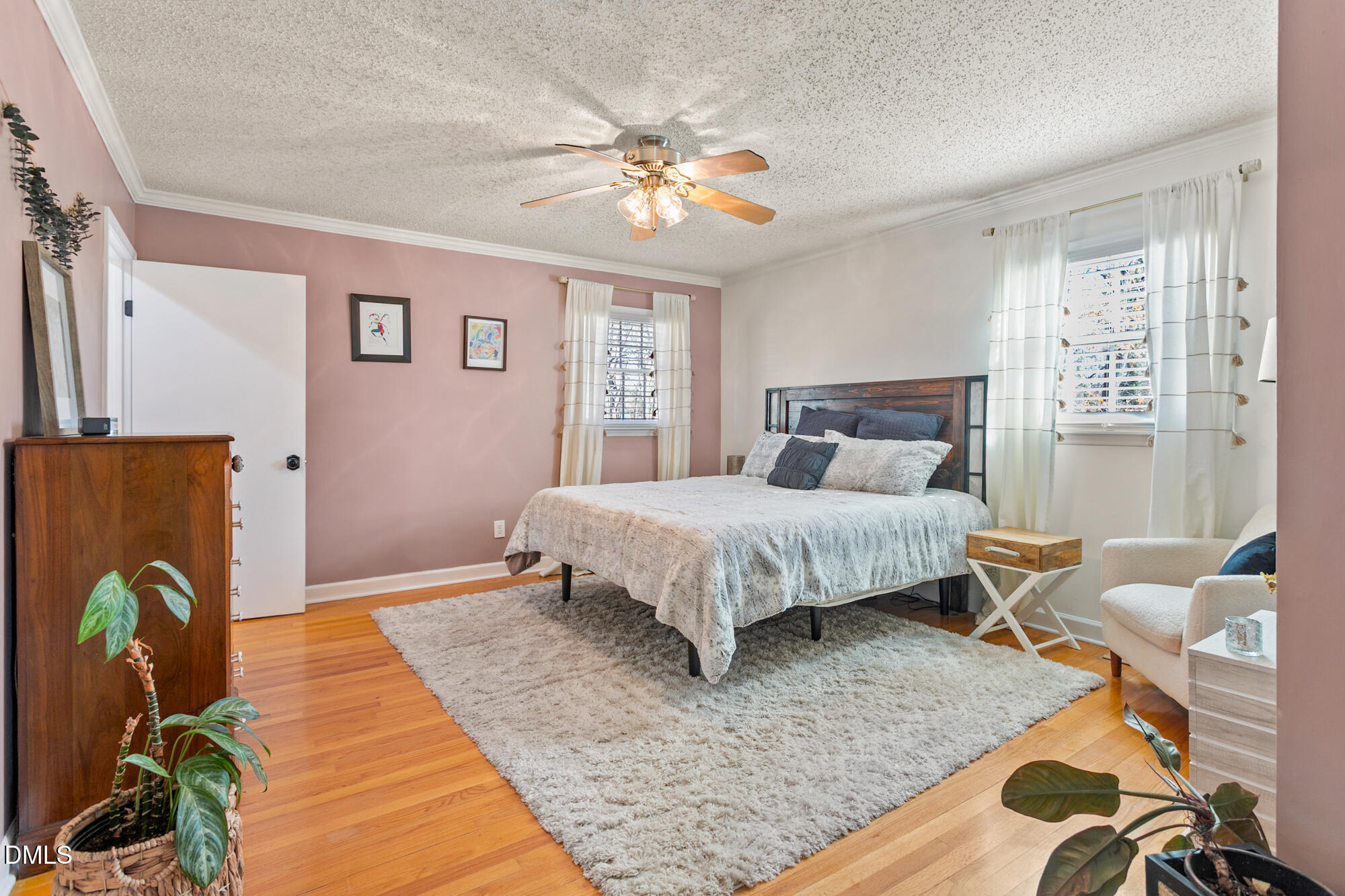 1263 Geneva Albright Road Graham, NC 27253 - Photo 31 of 61 a bedroom with a bed and a chandelier