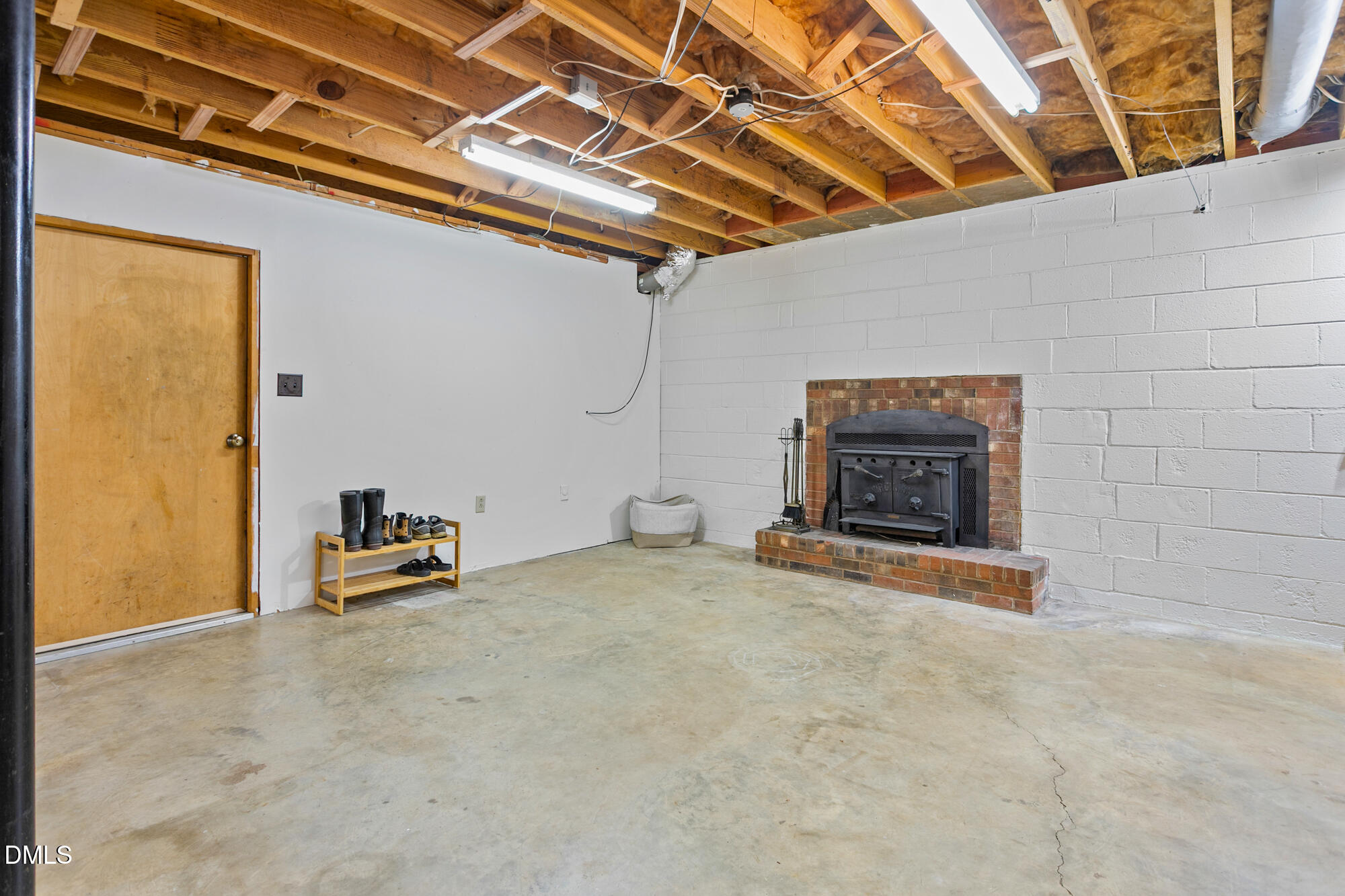 1263 Geneva Albright Road Graham, NC 27253 - Photo 36 of 61 a view of an empty room with a fireplace