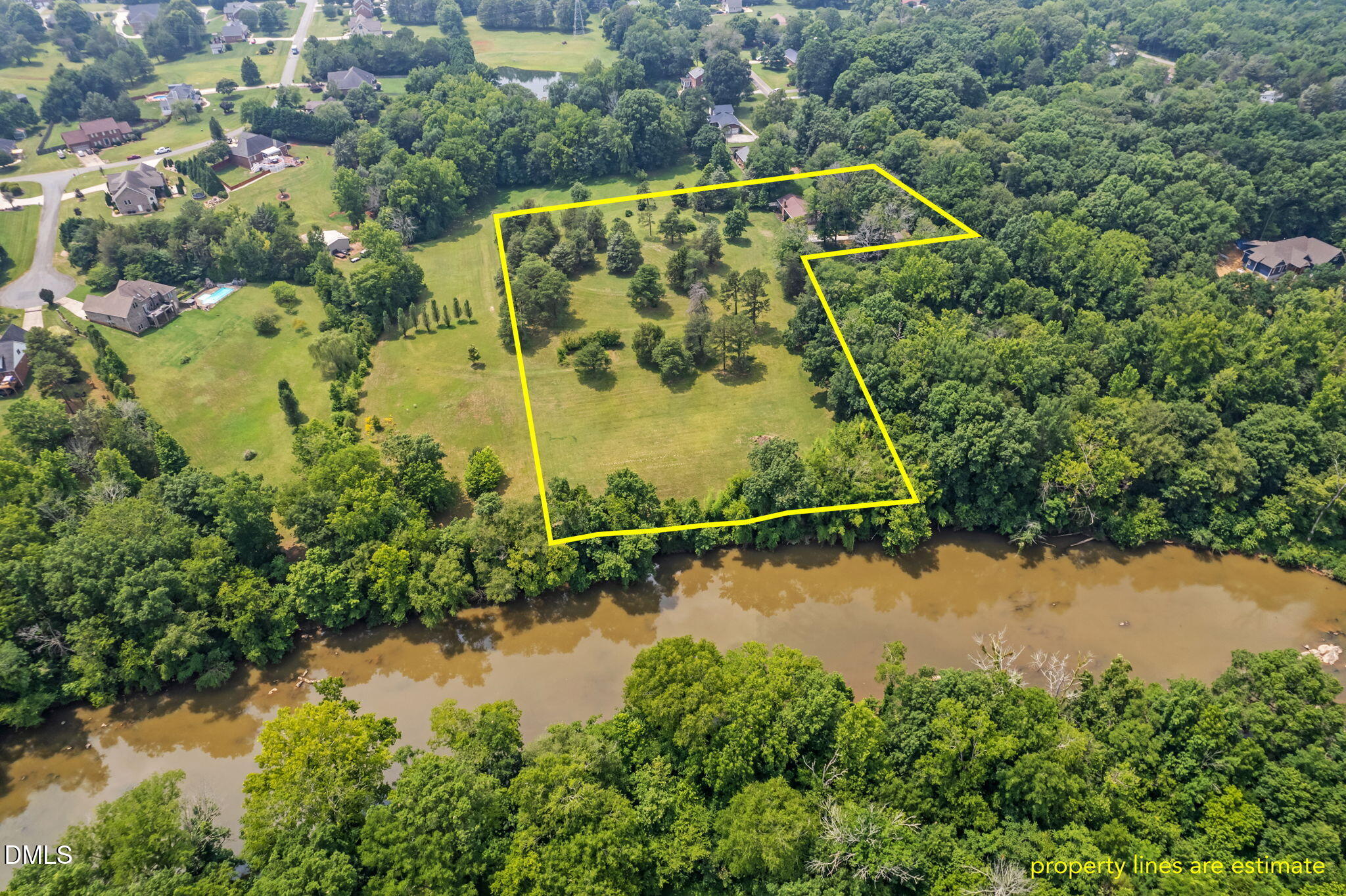 1263 Geneva Albright Road Graham, NC 27253 - Photo 6 of 61 an aerial view of a house with a yard and lake view