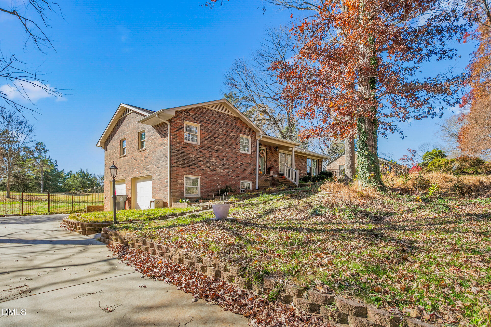 1263 Geneva Albright Road Graham, NC 27253 - Photo 8 of 61 a front view of a house with a yard
