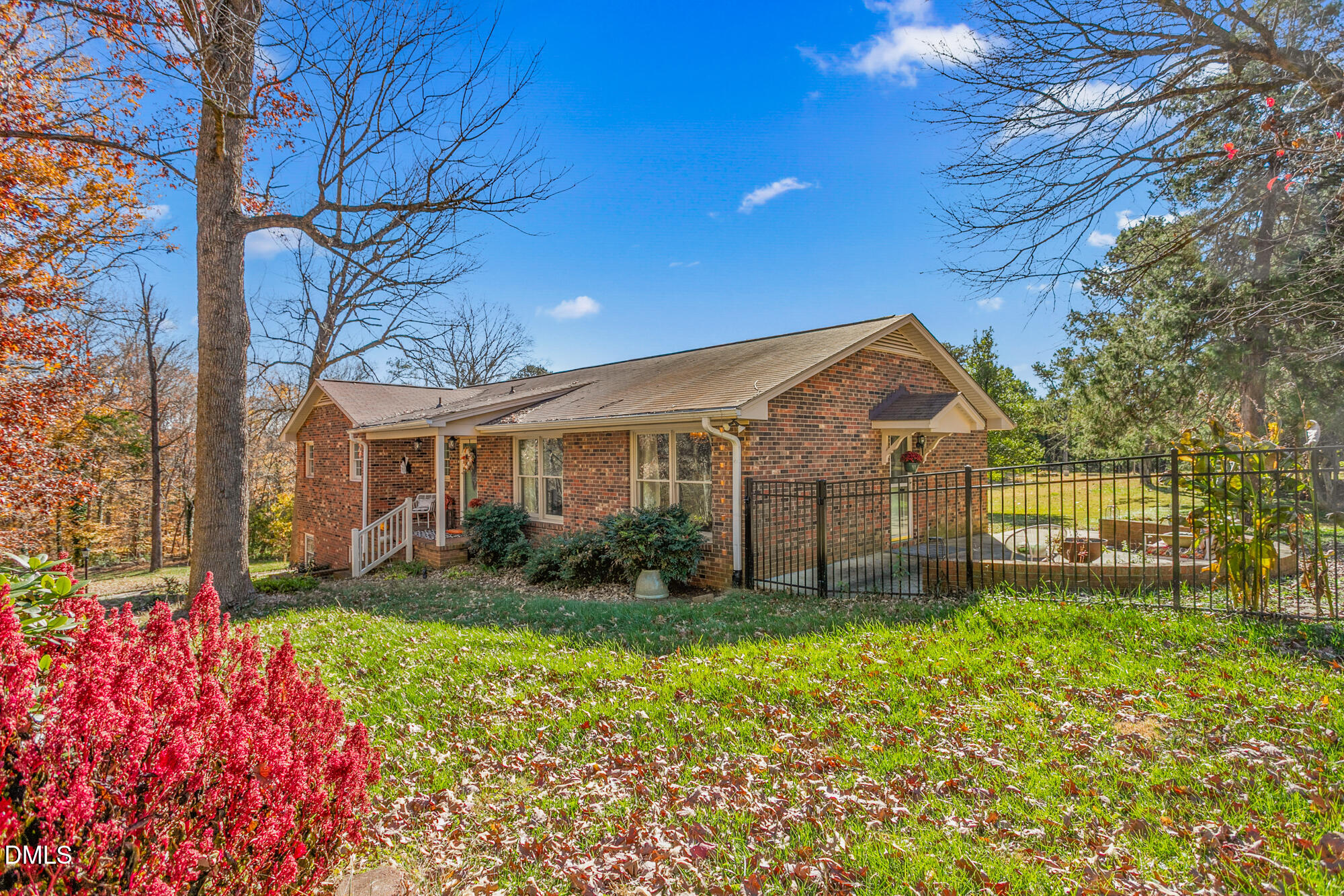 1263 Geneva Albright Road Graham, NC 27253 - Photo 10 of 61 a front view of a house with a yard and potted plants