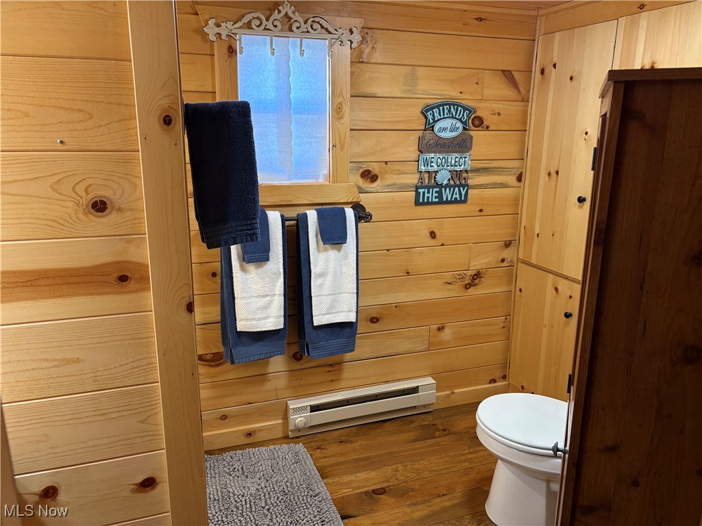 5919 Lake Road West, Unit 13 Ashtabula, OH 44004 - Photo 15 of 35 Bathroom with wood walls and baseboard heating
