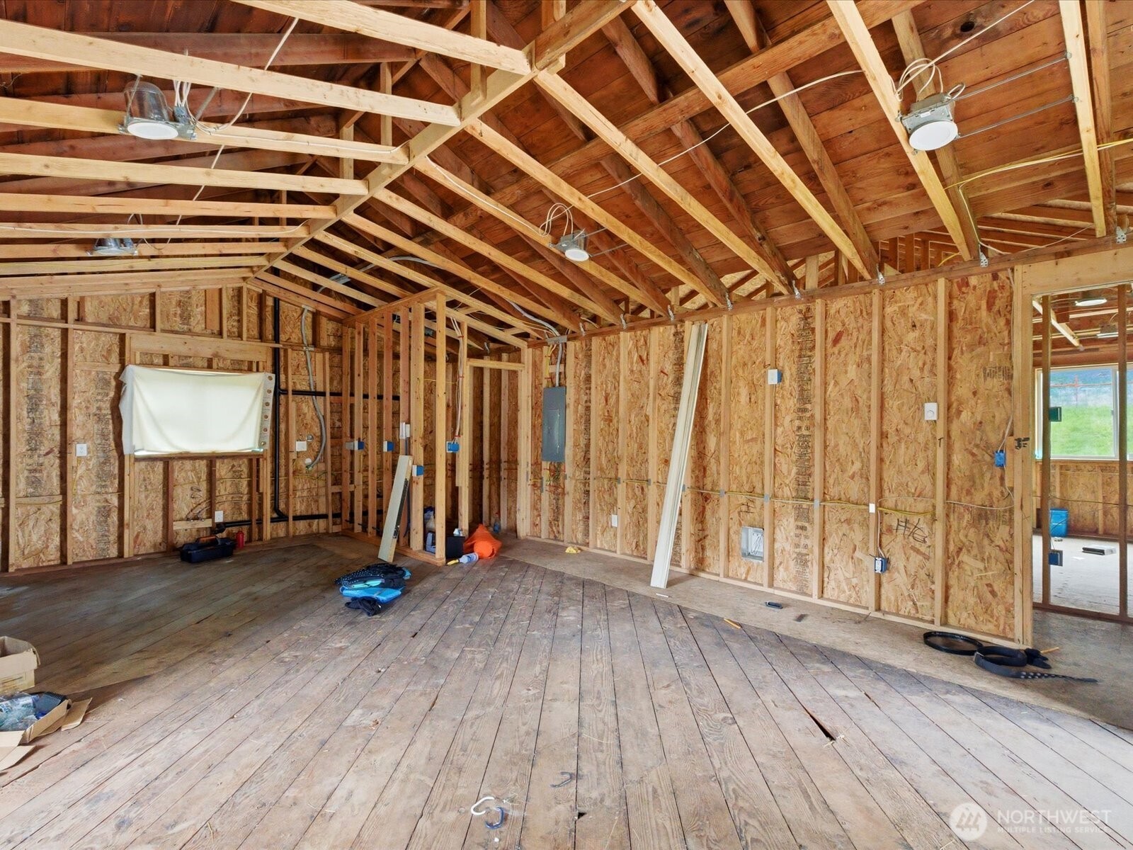 16602-16608 Delano Road Southwest Lakebay, WA 98349 - Photo 12 of 40 an empty room with wooden floor and windows