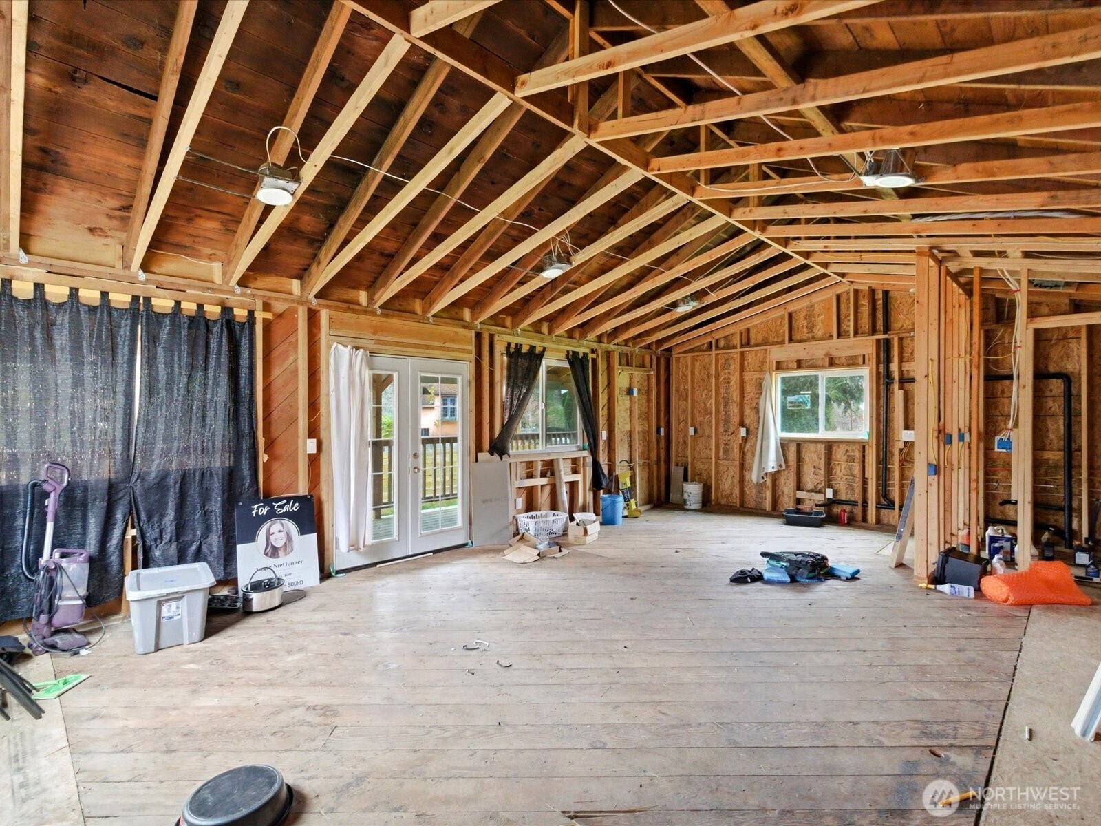 16602-16608 Delano Road Southwest Lakebay, WA 98349 - Photo 14 of 40 a view of a room with wooden floor