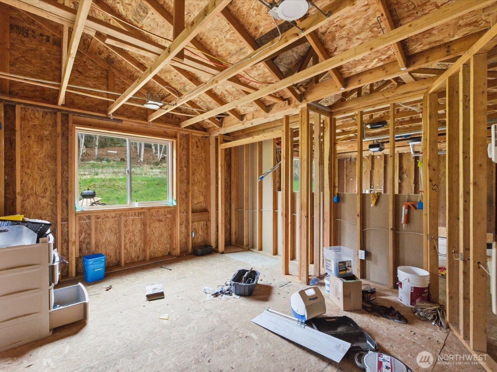 16602-16608 Delano Road Southwest Lakebay, WA 98349 - Photo 16 of 40 a bedroom with furniture and a window