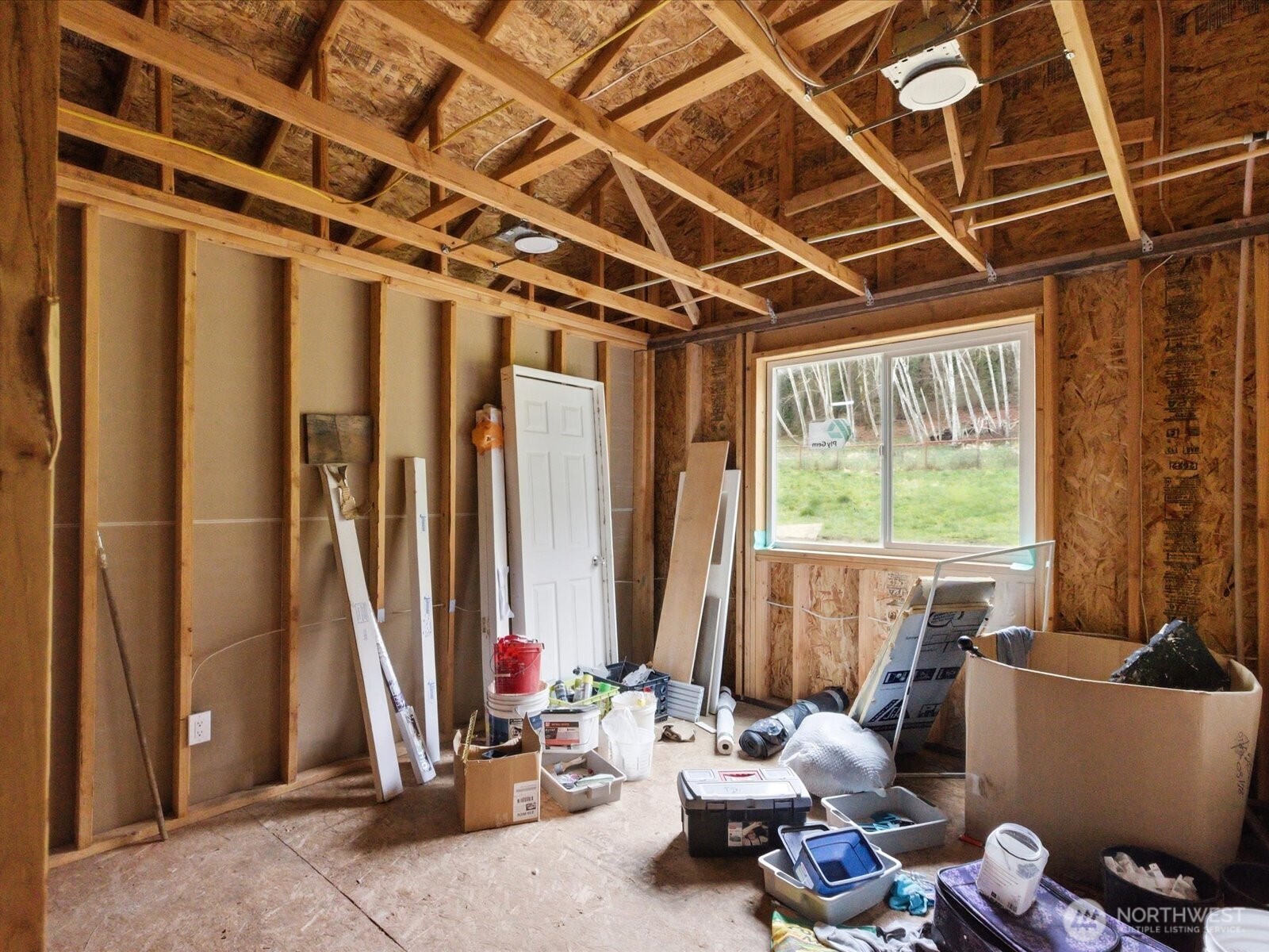 16602-16608 Delano Road Southwest Lakebay, WA 98349 - Photo 17 of 40 a living room with furniture and a floor to ceiling window