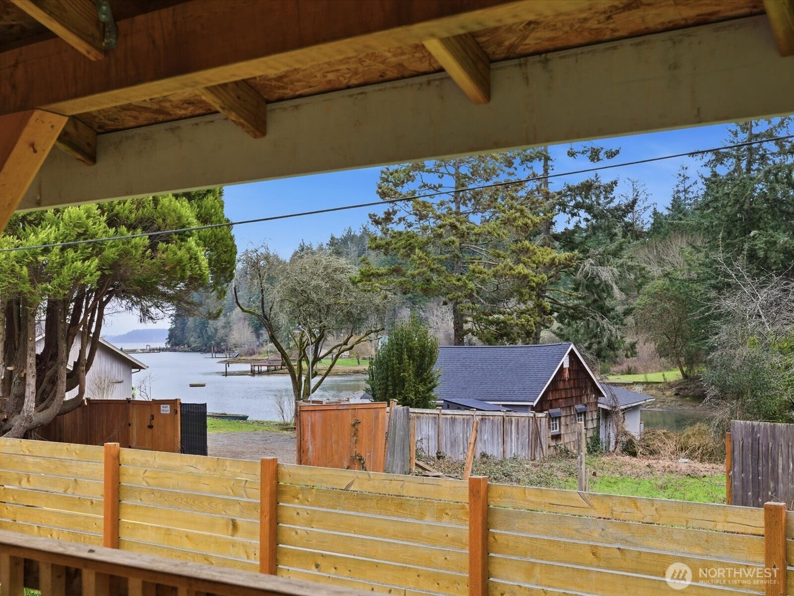 16602-16608 Delano Road Southwest Lakebay, WA 98349 - Photo 21 of 40 a view of a house with a yard