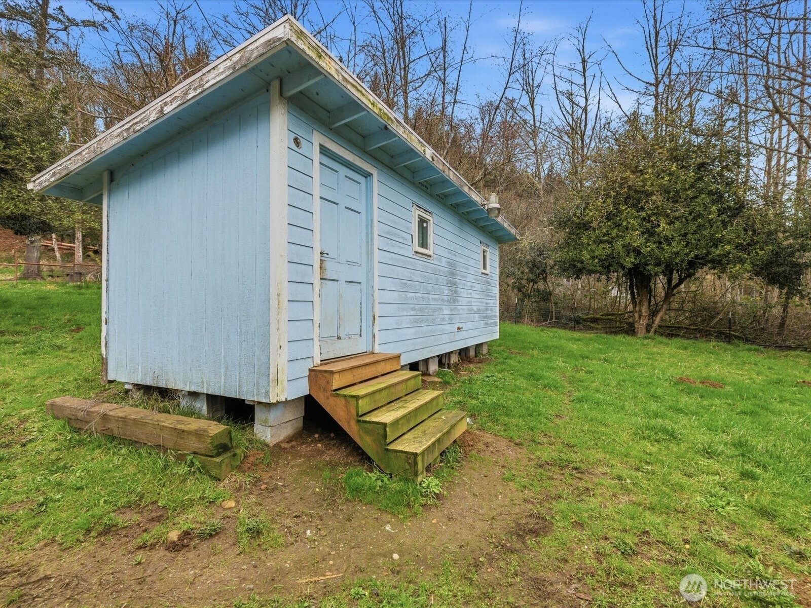 16602-16608 Delano Road Southwest Lakebay, WA 98349 - Photo 23 of 40 a backyard of a house with a garden and entertaining space
