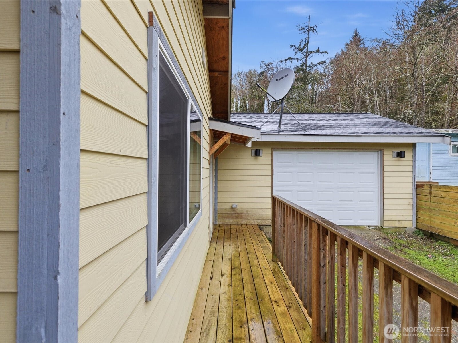 16602-16608 Delano Road Southwest Lakebay, WA 98349 - Photo 29 of 40 a view of balcony with wooden floor and fence