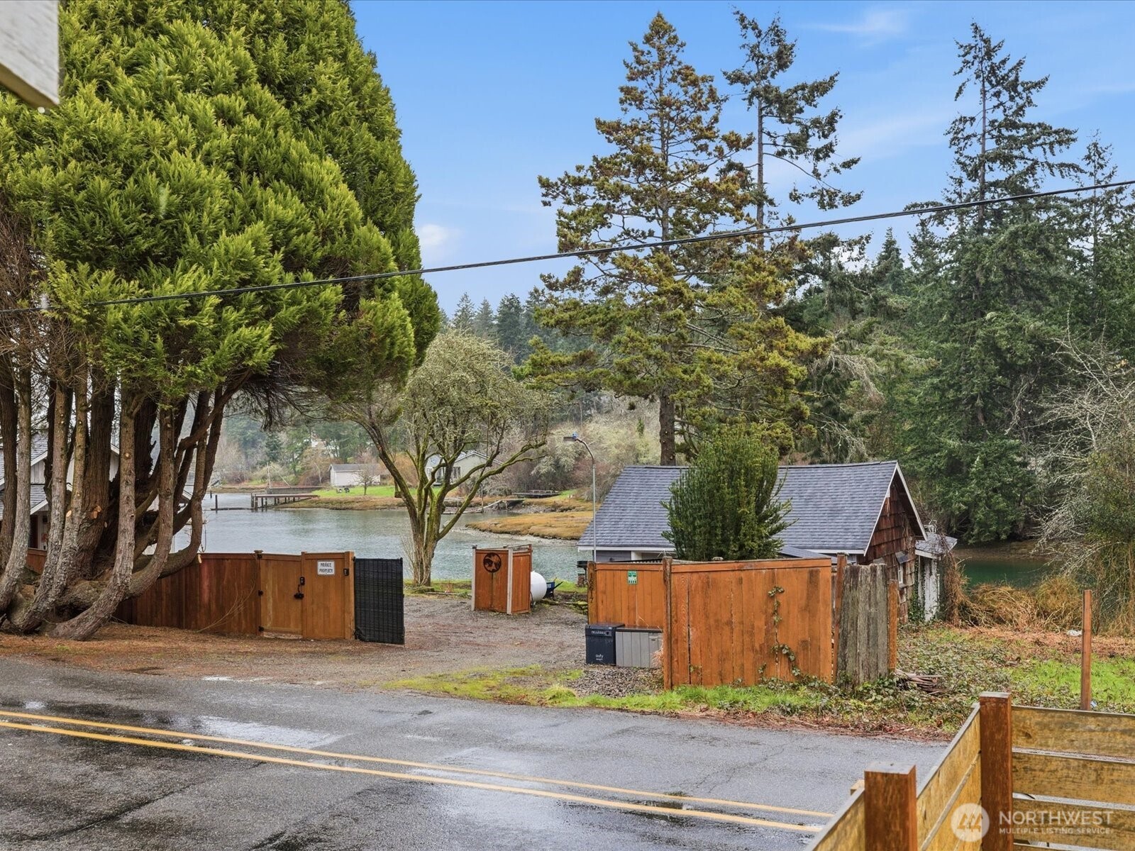 16602-16608 Delano Road Southwest Lakebay, WA 98349 - Photo 31 of 40 front view of house with a small yard