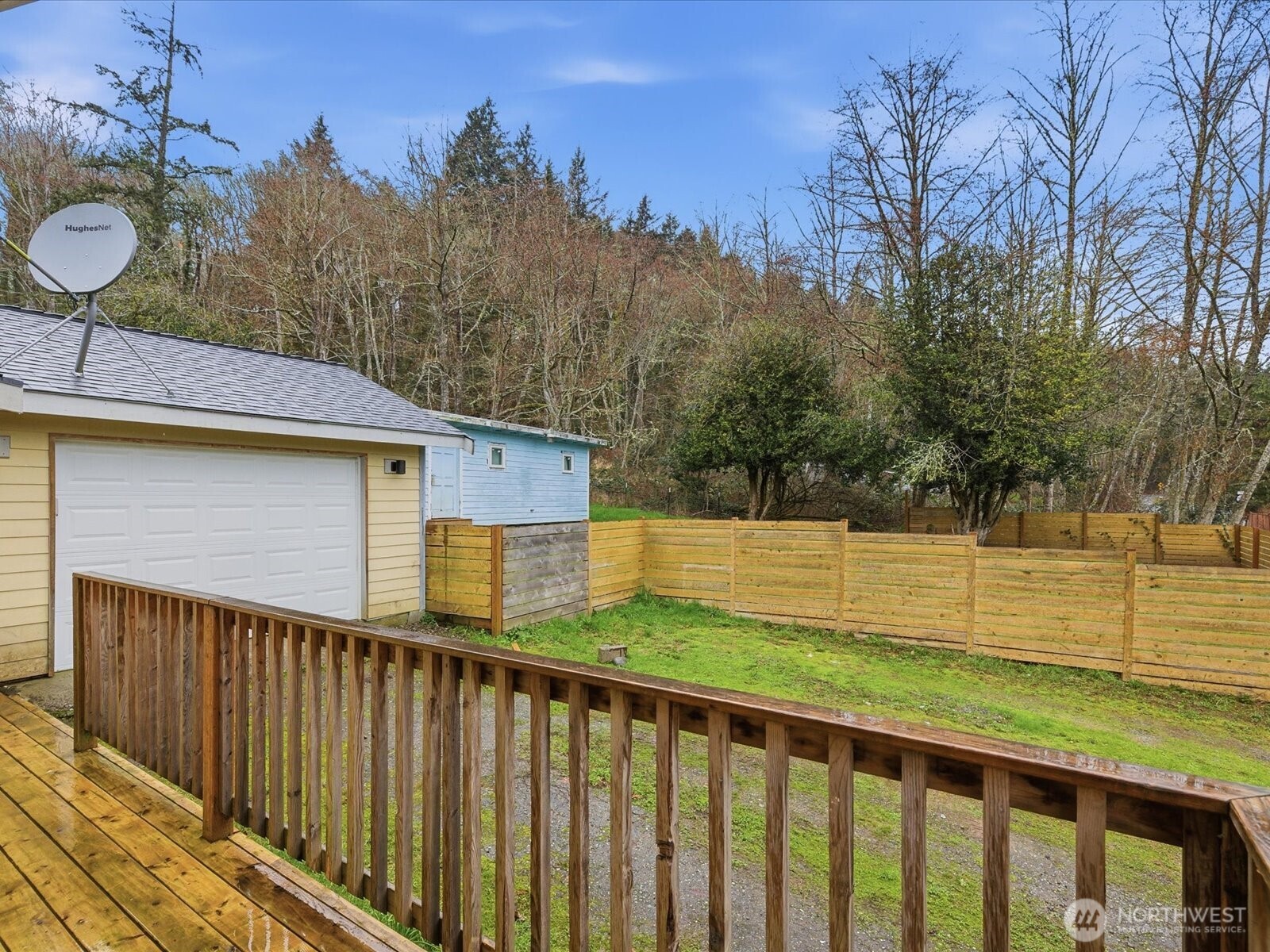 16602-16608 Delano Road Southwest Lakebay, WA 98349 - Photo 32 of 40 a view of a backyard with wooden fence