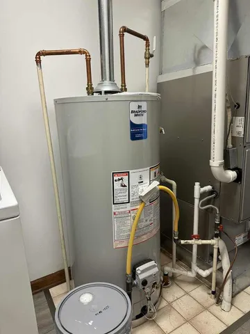 a bathroom with a sink mirror and toilet