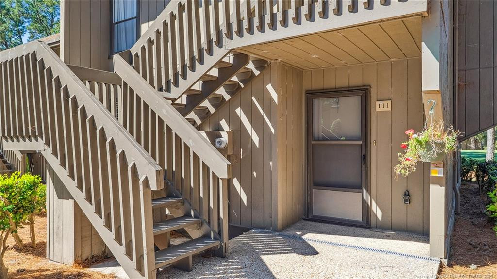 a view of entryway with wooden floor