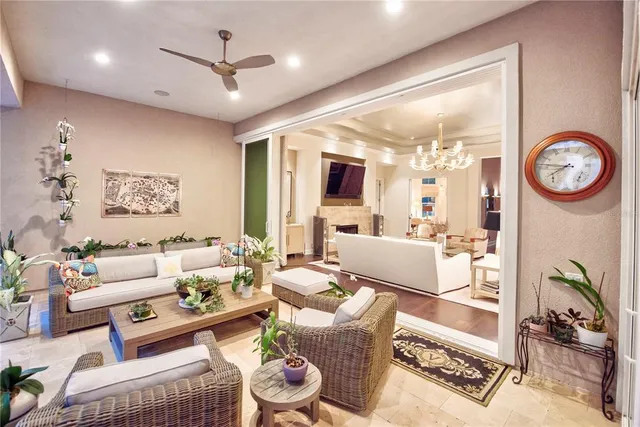 a living room with furniture and a book shelf