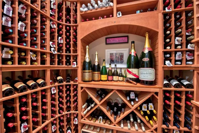 a view of living room with furniture and large window