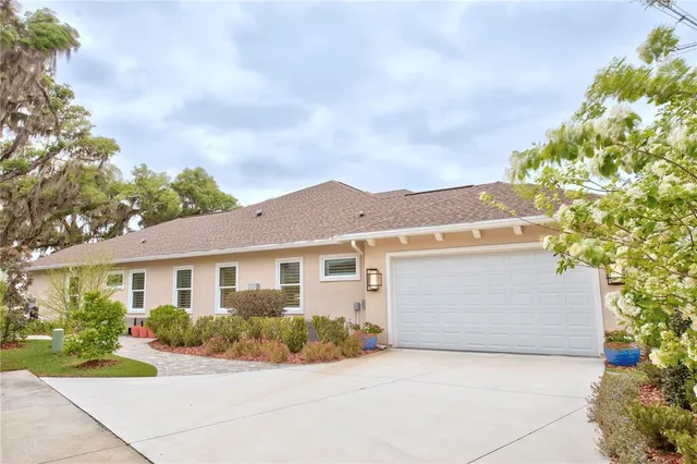 a aerial view of a house with a yard