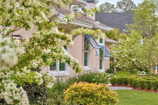 an aerial view of multiple houses with a yard