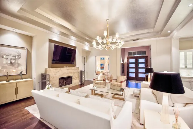 a bedroom with furniture and a large window