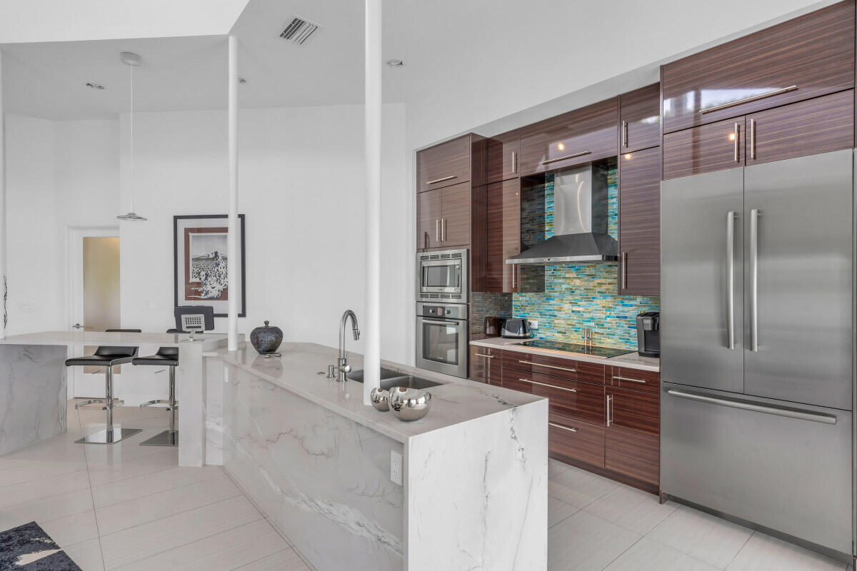 108 Sunset Drive Marathon, FL 33050 - Photo 11 of 46 a kitchen with a sink and refrigerator