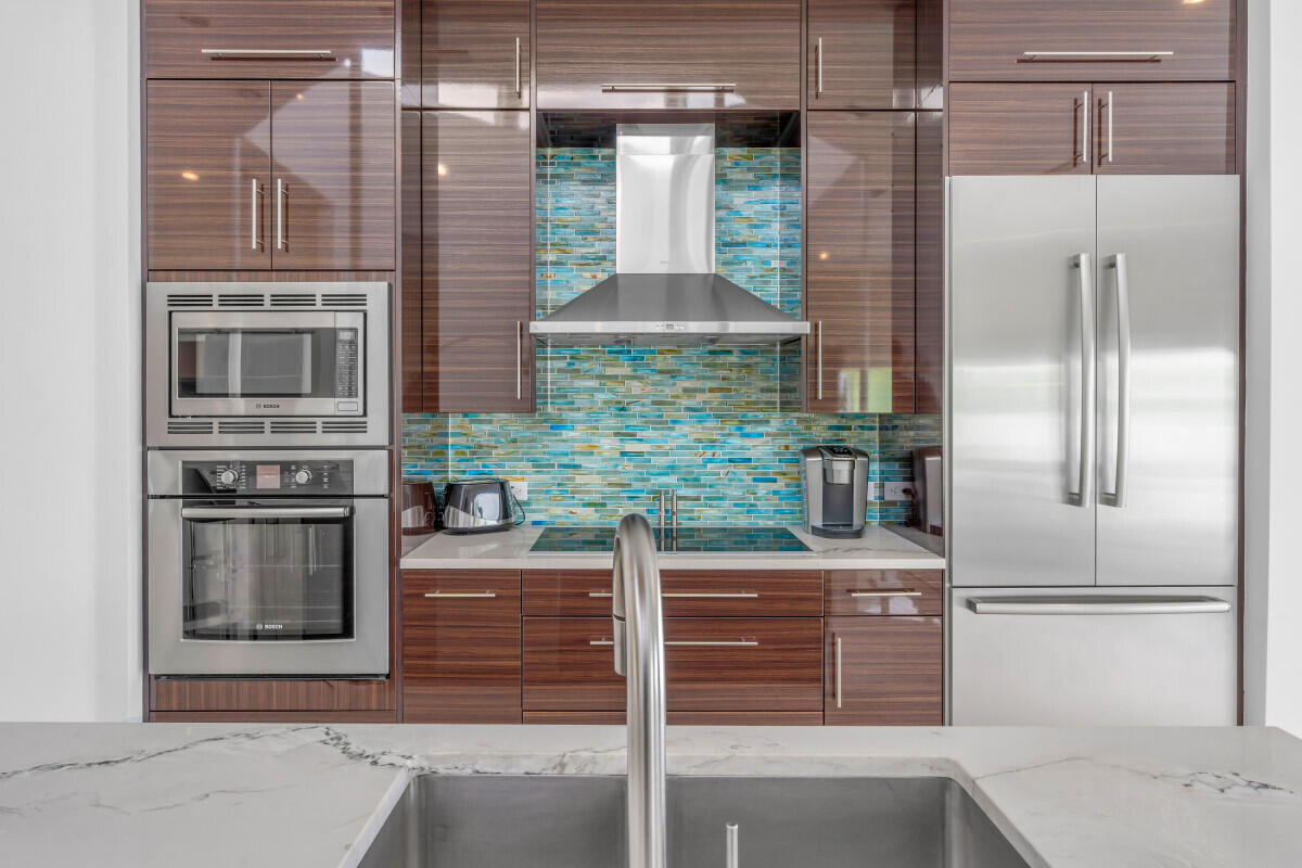 108 Sunset Drive Marathon, FL 33050 - Photo 12 of 46 a kitchen view with granite countertop a oven and a refrigerator