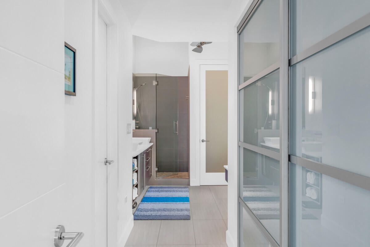 108 Sunset Drive Marathon, FL 33050 - Photo 16 of 46 a bathroom with a sink and a mirror