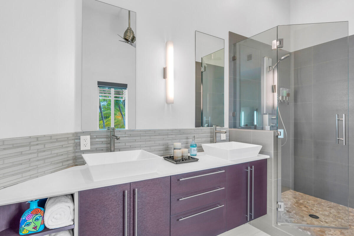 108 Sunset Drive Marathon, FL 33050 - Photo 17 of 46 a bathroom with a sink double vanity and a mirror