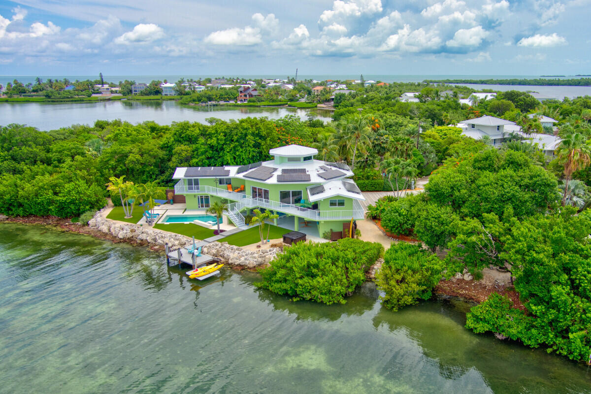 108 Sunset Drive Marathon, FL 33050 - Photo 23 of 46 a aerial view of a house with outdoor space and lake view