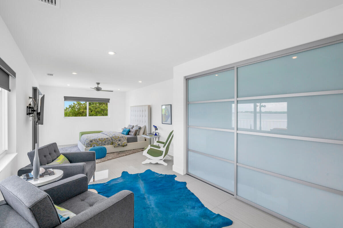 108 Sunset Drive Marathon, FL 33050 - Photo 25 of 46 a living room with furniture and a wooden floor