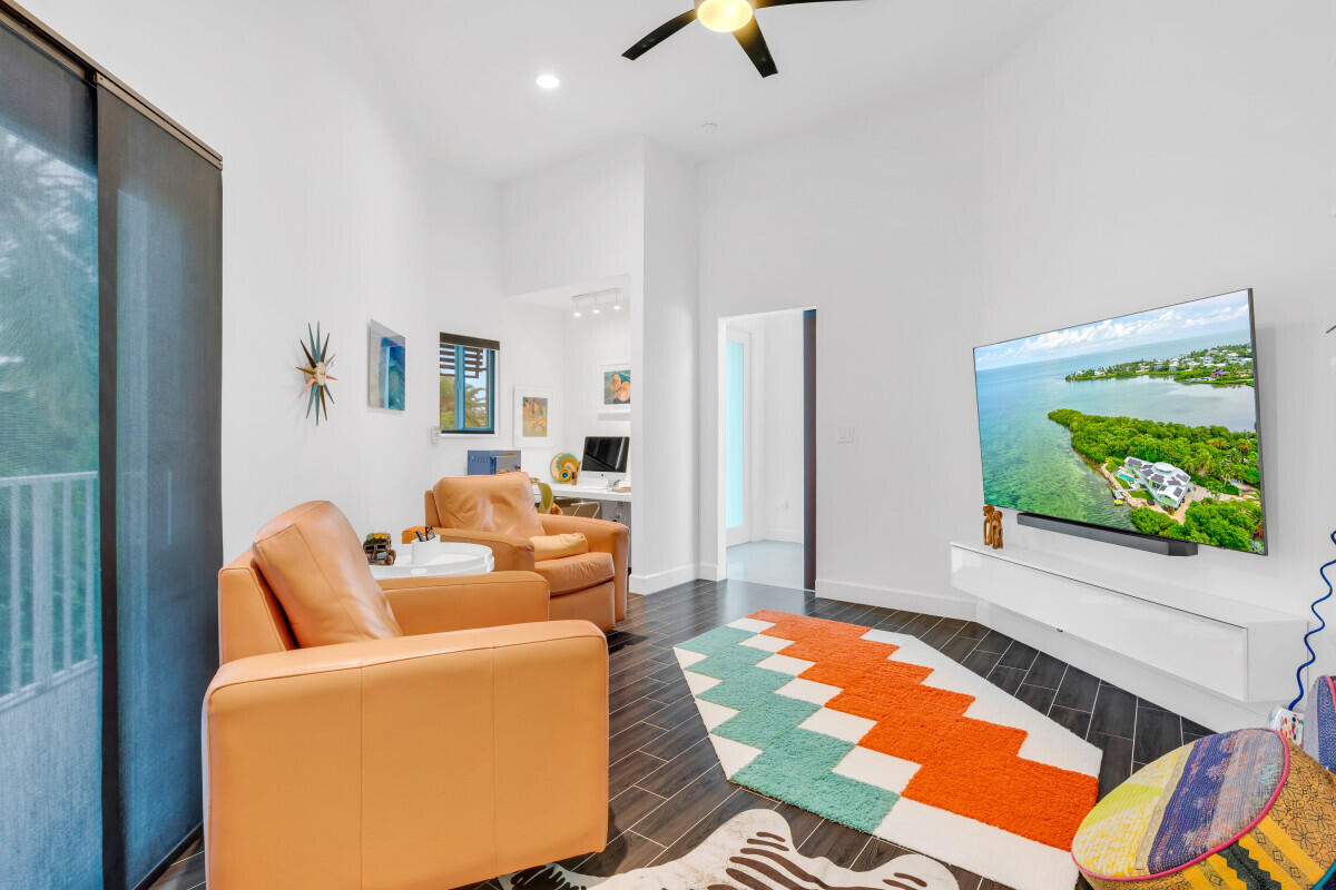 108 Sunset Drive Marathon, FL 33050 - Photo 27 of 46 a living room with furniture and a flat screen tv