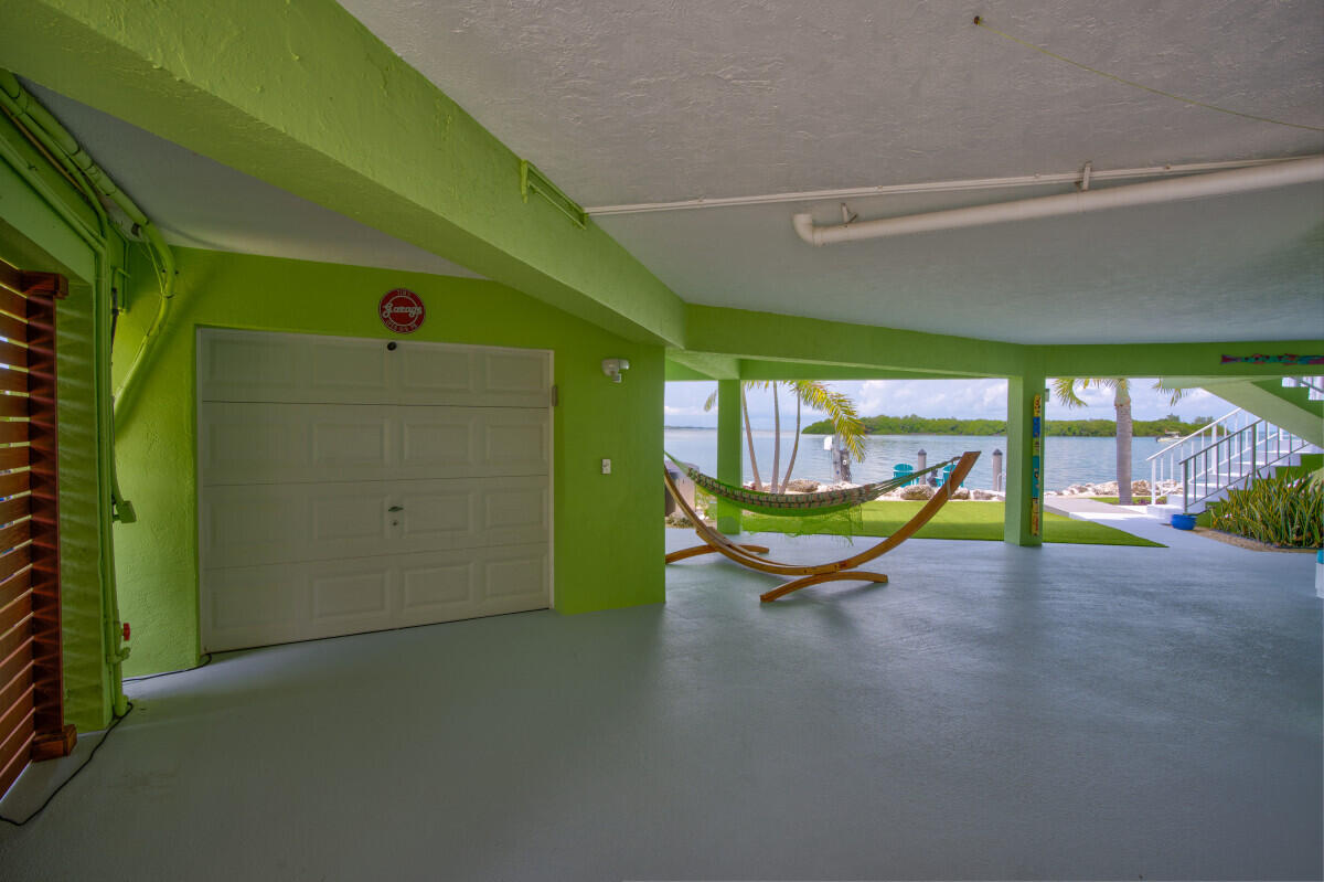 108 Sunset Drive Marathon, FL 33050 - Photo 30 of 46 a swimming pool with outdoor seating