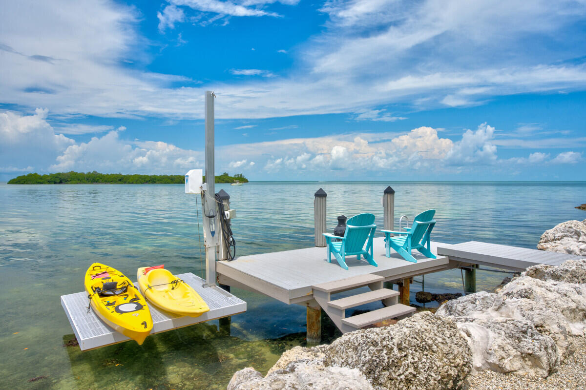 108 Sunset Drive Marathon, FL 33050 - Photo 36 of 46 a view of a terrace with wooden floor