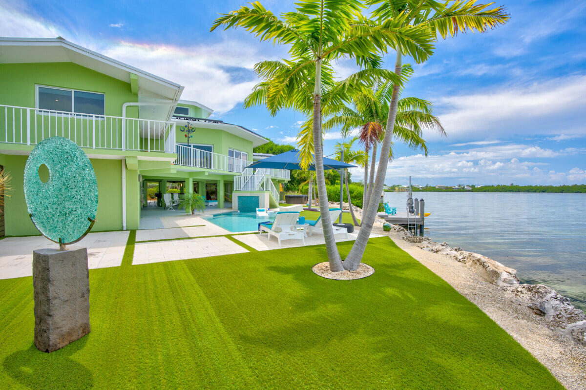 108 Sunset Drive Marathon, FL 33050 - Photo 37 of 46 a view of a backyard with swimming pool