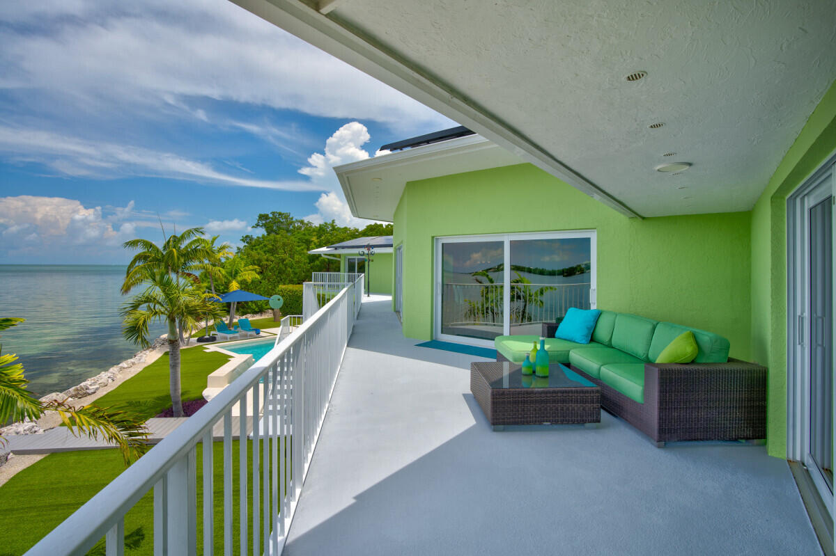 108 Sunset Drive Marathon, FL 33050 - Photo 40 of 46 a porch with seating space