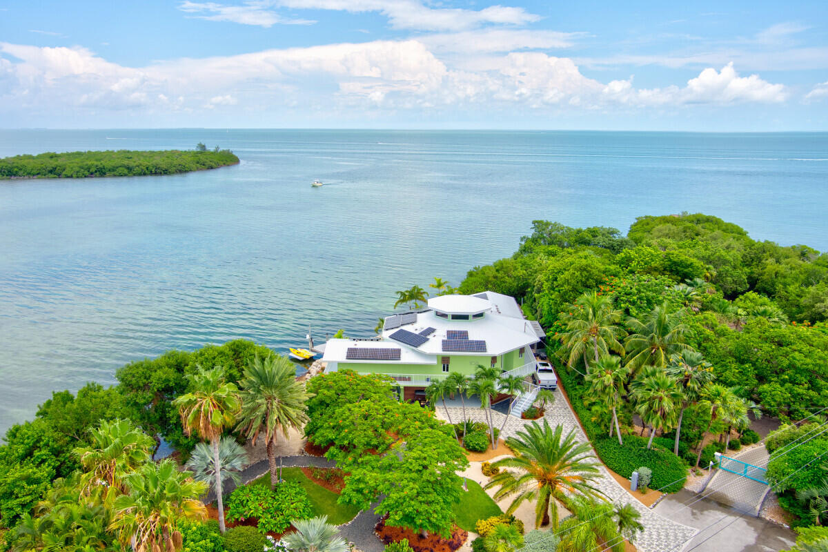 108 Sunset Drive Marathon, FL 33050 - Photo 4 of 46 a view of a lake with a yard