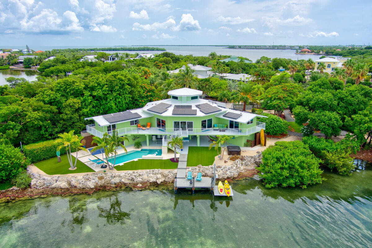 108 Sunset Drive Marathon, FL 33050 - Photo 43 of 46 a front view of a house with garden
