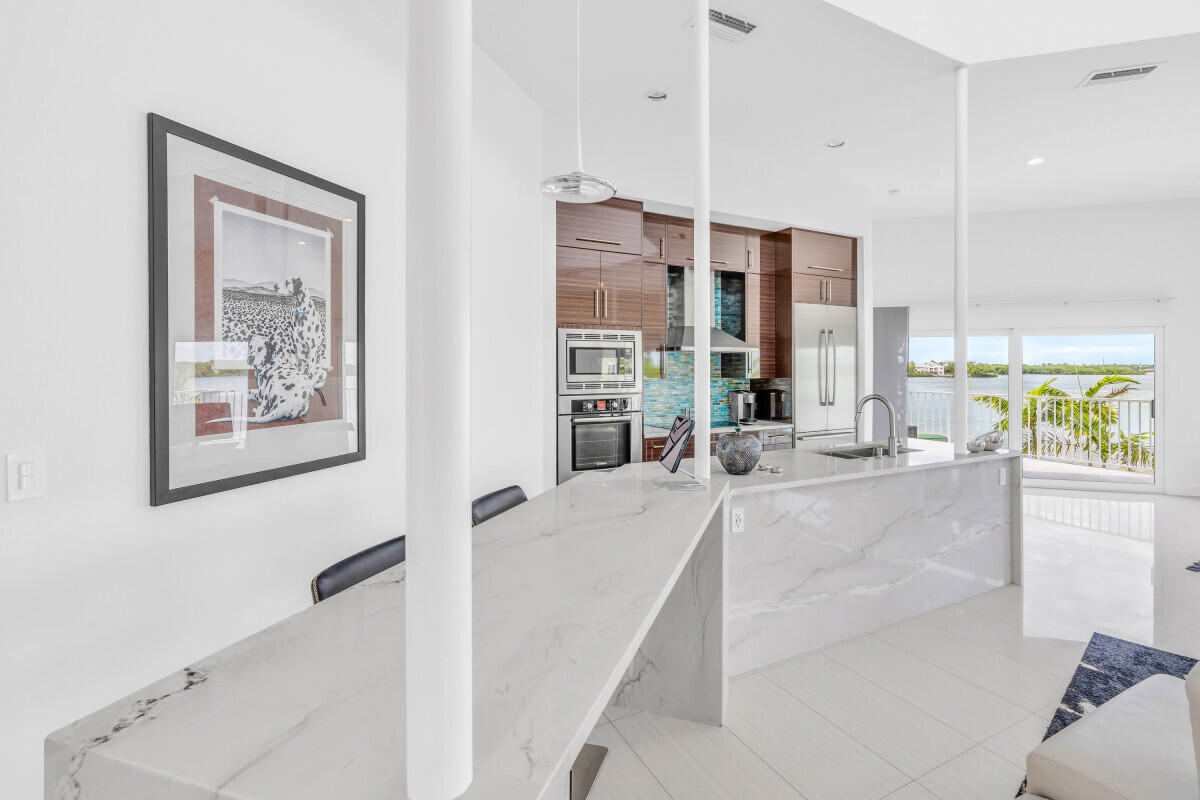 108 Sunset Drive Marathon, FL 33050 - Photo 10 of 46 a large white kitchen with a large window