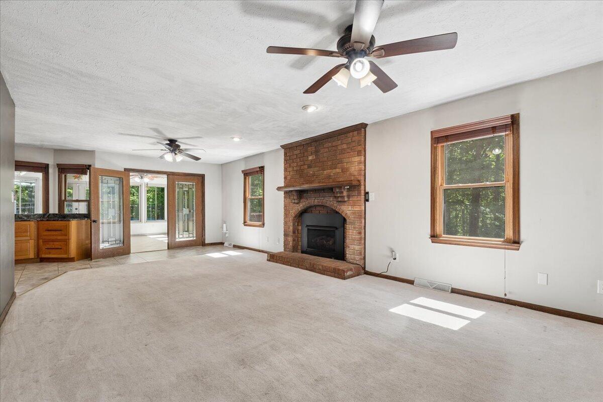 431 Langdon Road Evington, VA 24550 - Photo 5 of 54 a view of an empty room with a fireplace and a window