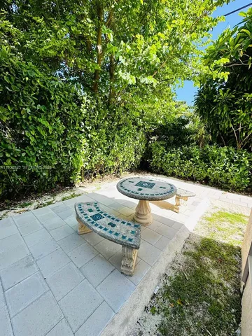 a view of a back yard of the house