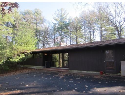 9 Stonehedge Road Lincoln, MA 01773 - Photo 1 of 14 a front view of a house with a yard