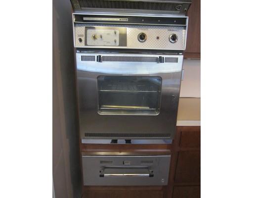 9 Stonehedge Road Lincoln, MA 01773 - Photo 13 of 14 a stove top oven sitting inside of a kitchen