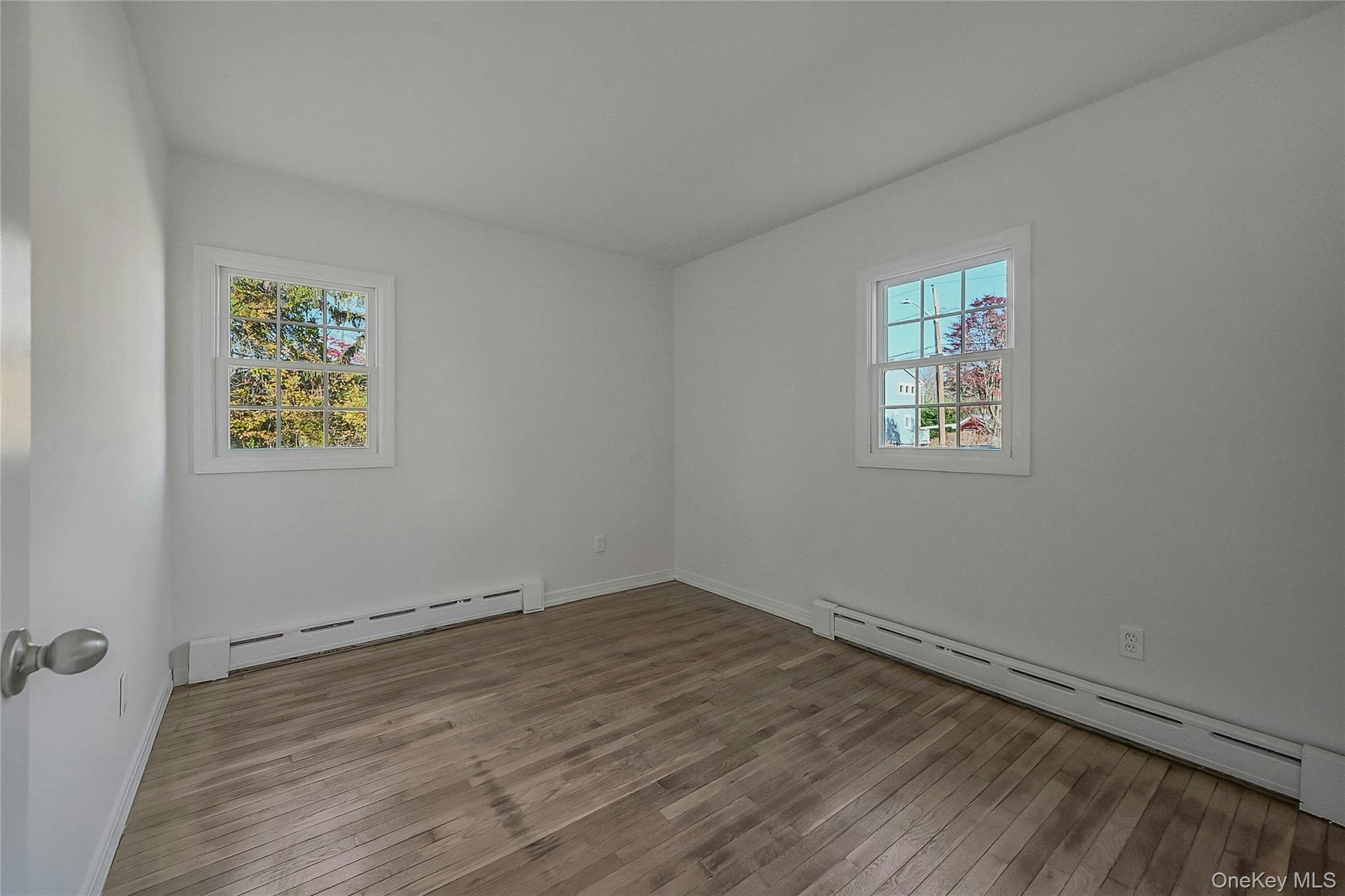 8 Pansy Road Rocky Point, NY 11778 - Photo 17 of 31 Main Floor Bedroom With Hardwood Flooring, All New Fresh Paint